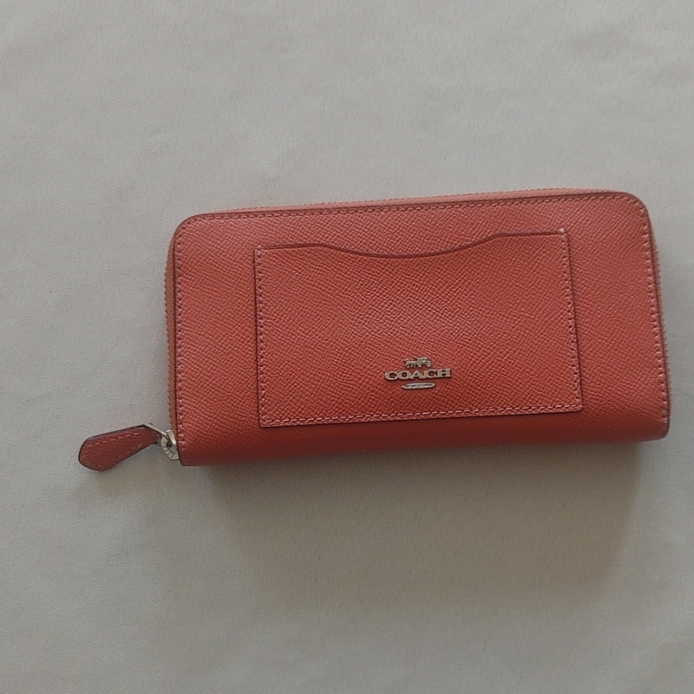 COACH. Tangerine orange salmon wallet.
